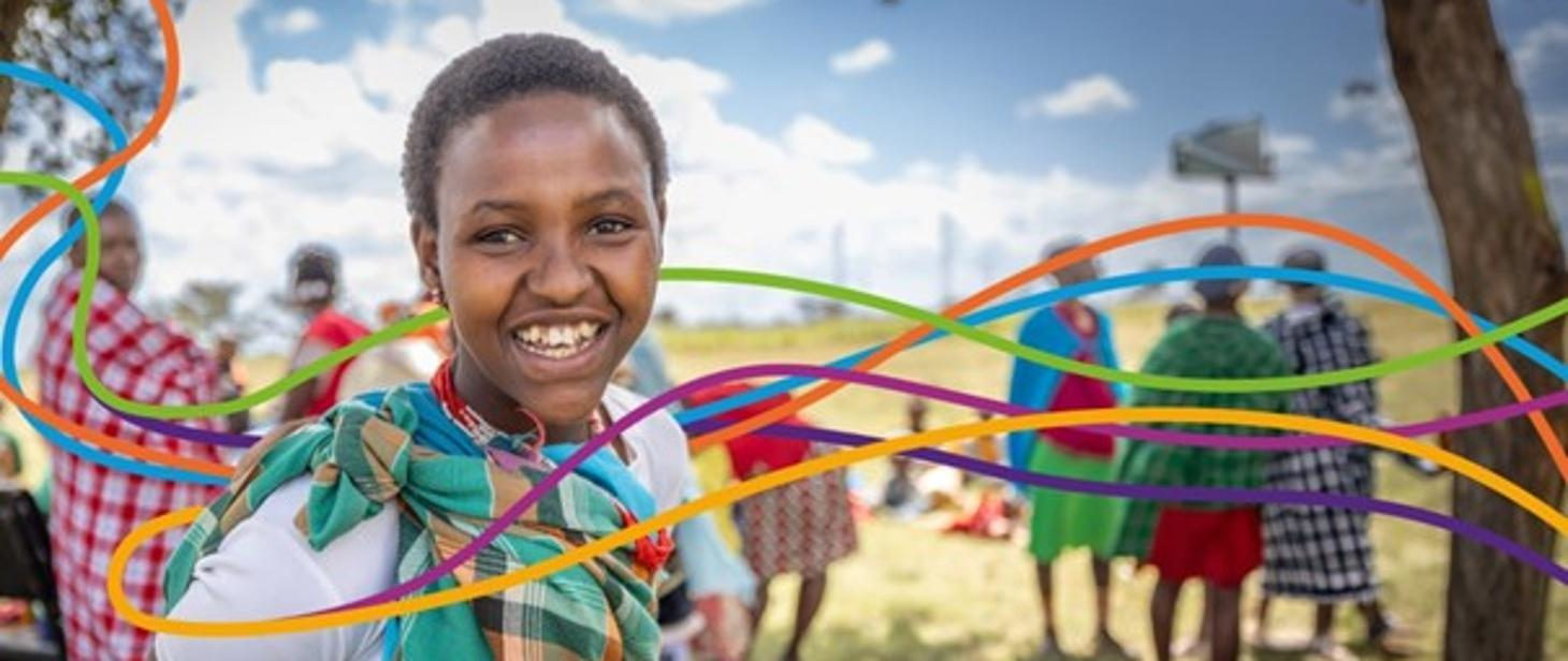 ilustracja przestawia ciemnoskórą dziewczynkę na tle afrykańskiej roślinności